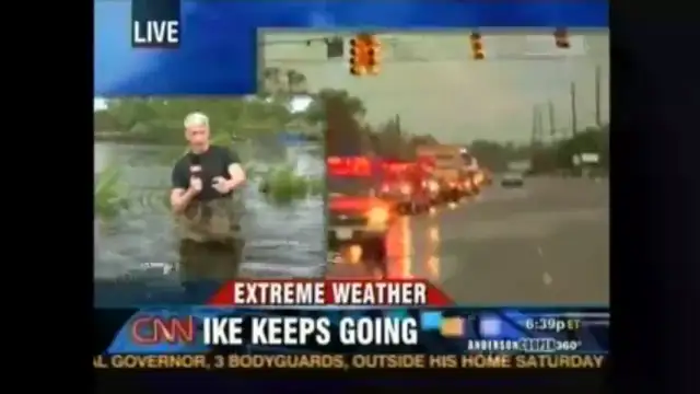 Dog bust Anderson Copper pretending to be in a flood up to his waist